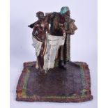 A CONTEMPORARY COLD PAINTED BRONZE FIGURE OF AN ARABIC MALE modelled upon a carpet. 21 cm x 18 cm.