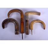 TWO 19TH CENTURY CARVED RHINOCEROS HORN WALKING CANE HANDLES together with two others. Largest 16 c