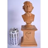 A 19TH CENTURY FRENCH TERRACOTTA STONEWARE BUST OF A MALE modelled upon a square form plinth. 30 cm