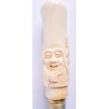 A CONTINENTAL CARVED BONE WALKING CANE. 96 cm long.