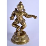 AN 18TH CENTURY SOUTH INDIAN BUDDHISTIC HINDU BRONZE DEITY modelled dancing. 13 cm high.