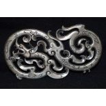 A Chinese white metal dragon Plaque. 11cm x 6 cm