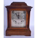 AN EARLY 20TH CENTURY OAK J W BENSON OF LONDON with silvered dial. 32 cm x 22 cm.