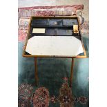 A Campaign Writing Table with fold down top. 76cm x 65cm