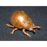 A small bronze Japanese scarab 6 cm