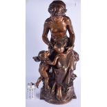 A VERY LARGE 19TH CENTURY FRENCH BRONZE FIGURE OF A FEMALE modelled pouring water into a putti's mo