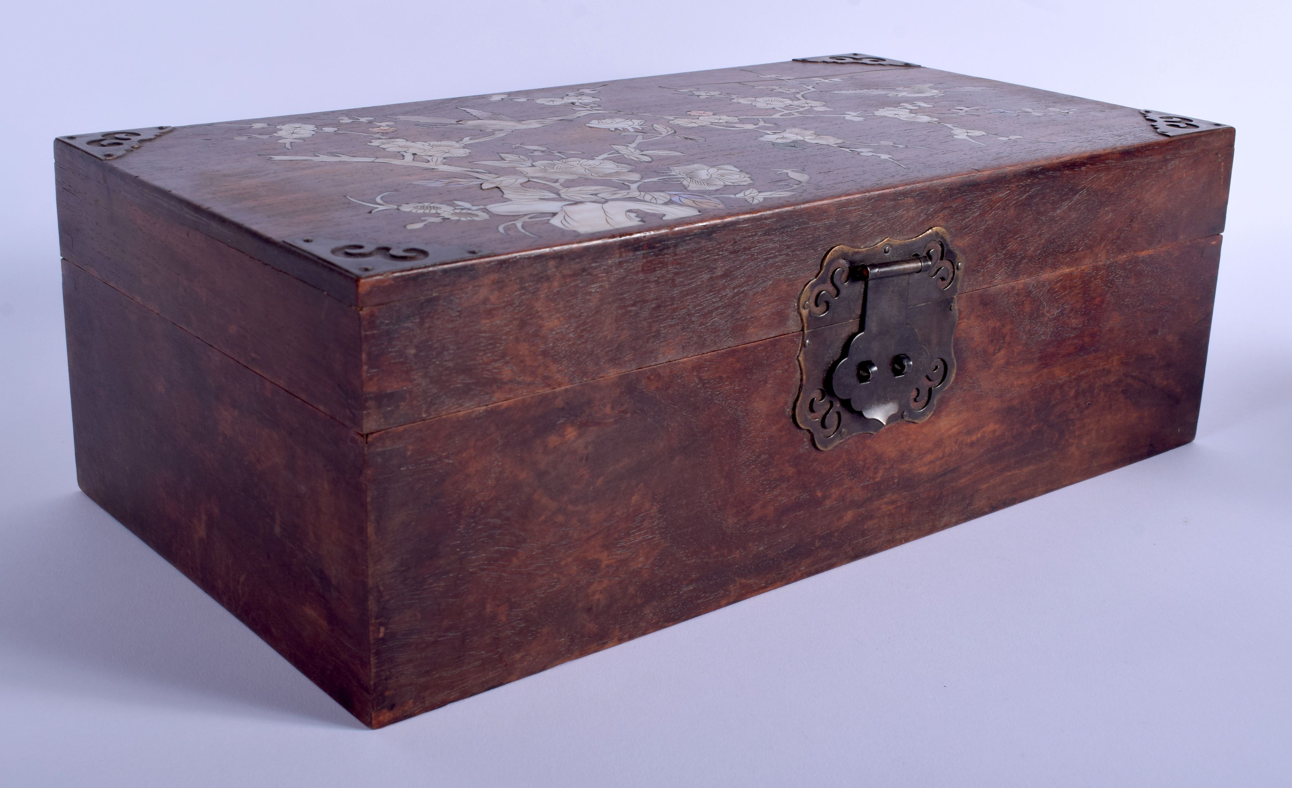 AN EARLY 20TH CENTURY CHINESE HONGMU HARDWOOD CASKET Late Qing, decorated with birds and foliage. 3