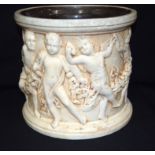 A Large Bretby pottery Jardiniere with cherubs moulded in classical style 27cm x 30cm