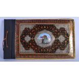 AN EARLY 20TH CENTURY PERSIAN MIDDLE EASTERN QAJAR LACQUER ALBUM with silver mounts and scrolling f