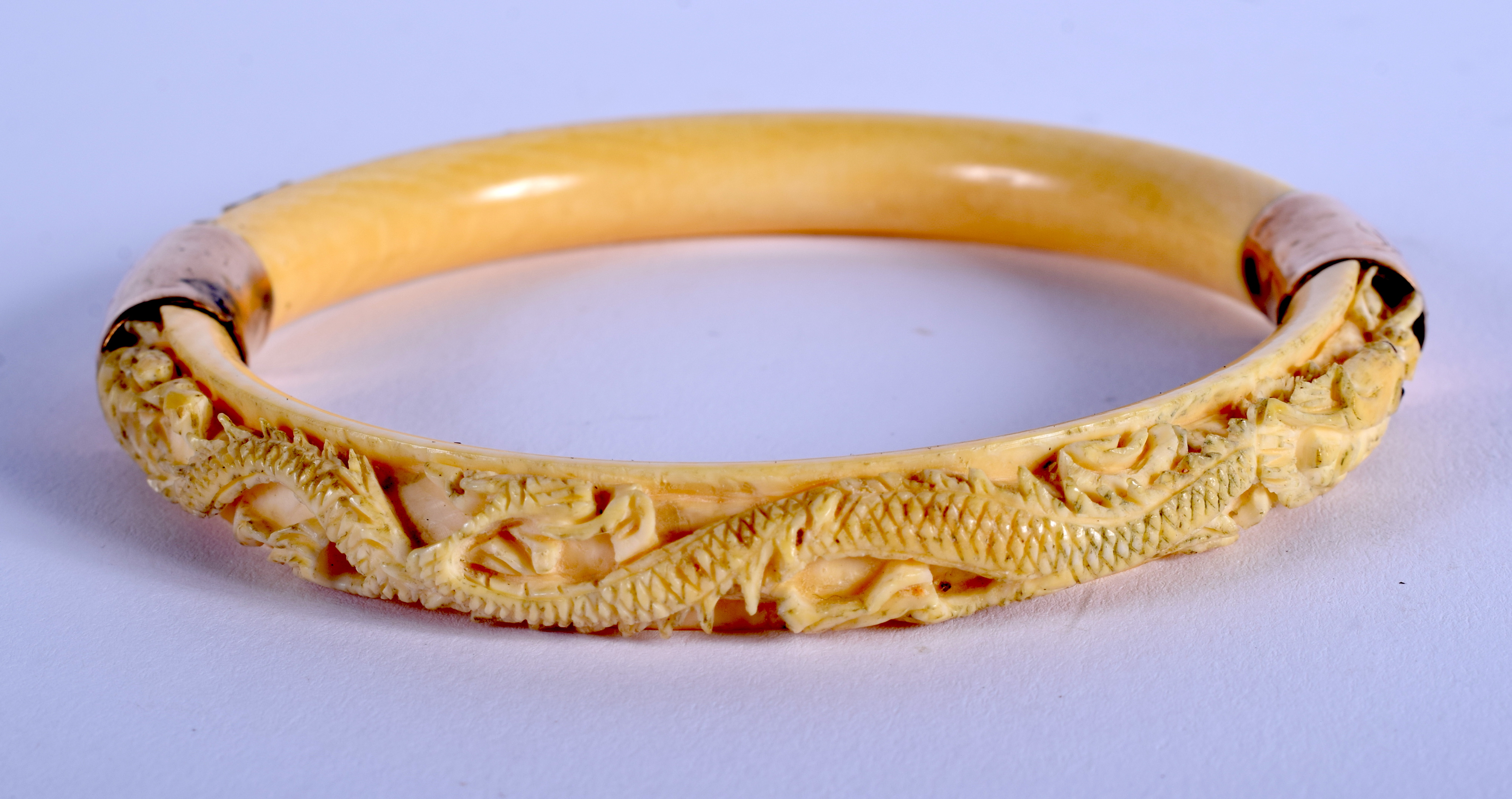 A 19TH CENTURY CHINESE CARVED IVORY DRAGON BANGLE Qing. 8.5 cm diameter.