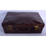 AN ANTIQUE CROCODILE SKIN LEATHER VANITY TRAVELLING CASE bearing initials UH to the top. 50 cm x 32