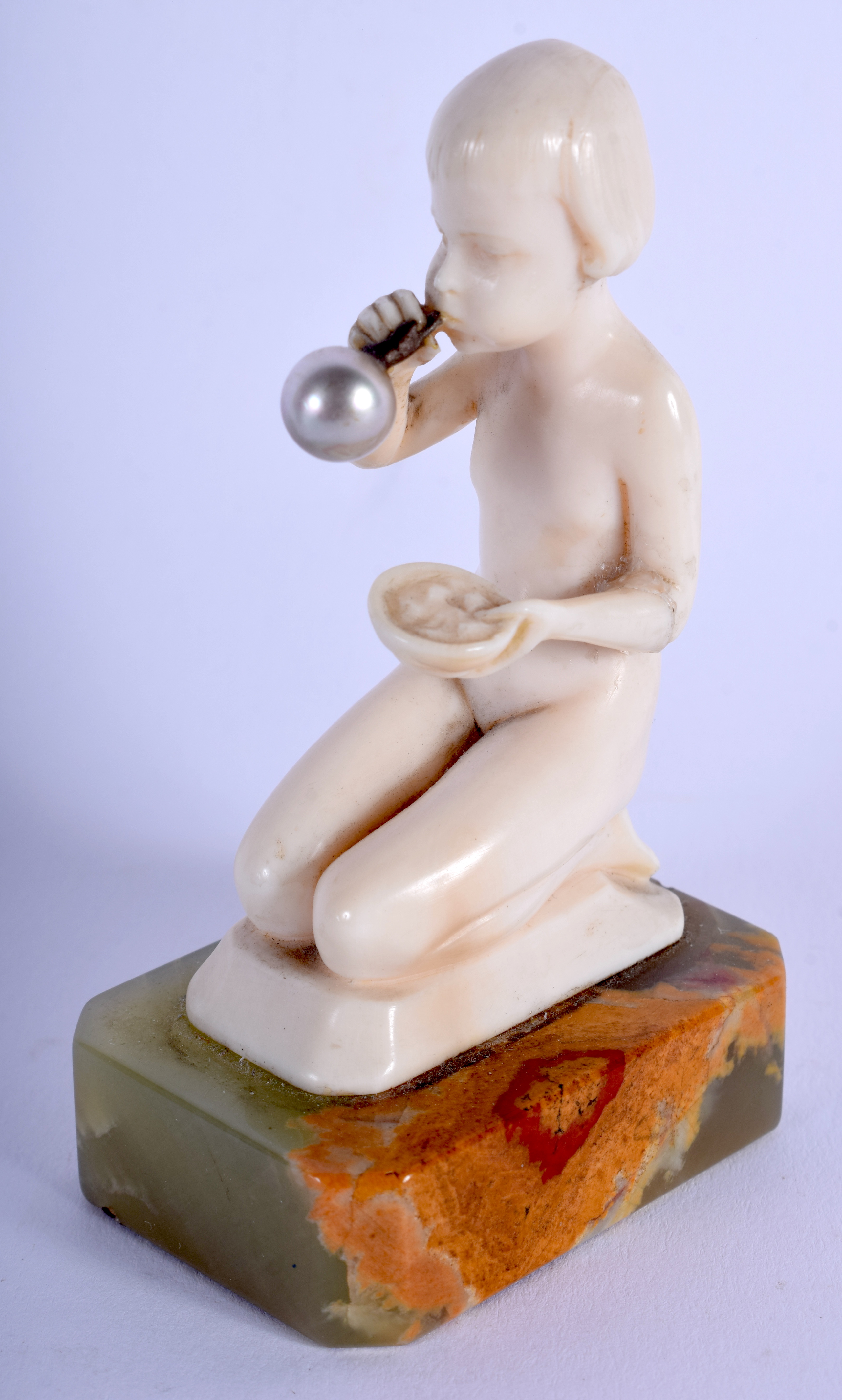 AN ART DECO CARVED IVORY FIGURE OF A BUBBLE BLOWING GIRL by Ferdinand Preiss (1882-1943), modelled