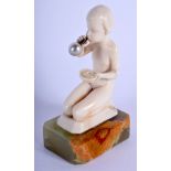 AN ART DECO CARVED IVORY FIGURE OF A BUBBLE BLOWING GIRL by Ferdinand Preiss (1882-1943), modelled