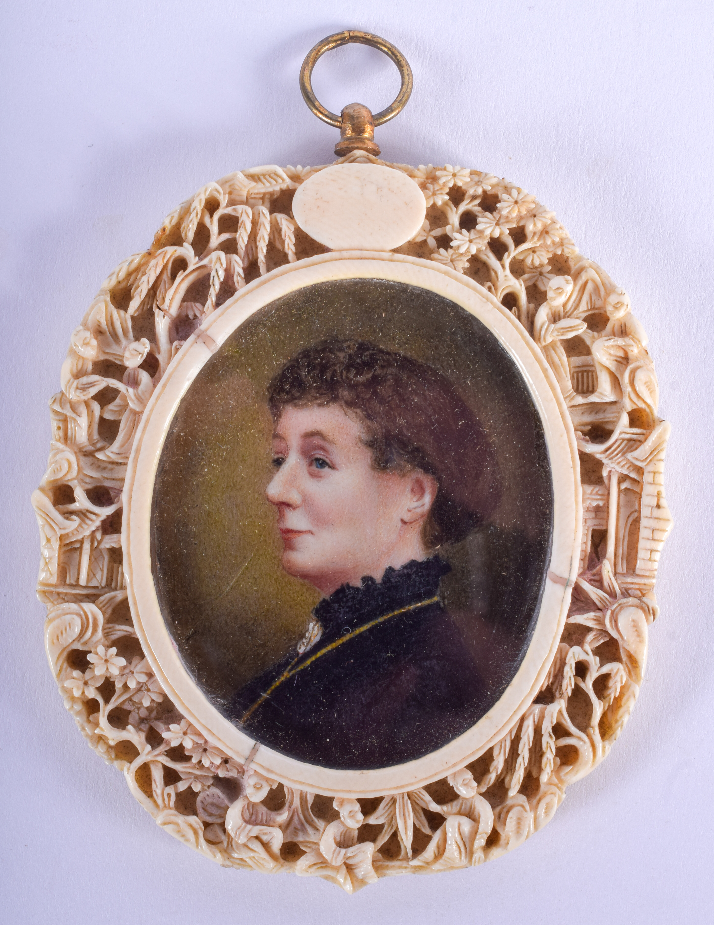 A 19TH CENTURY EUROPEAN CARVED IVORY PORTRAIT MINIATURE contained within a Qing dynasty ivory frame