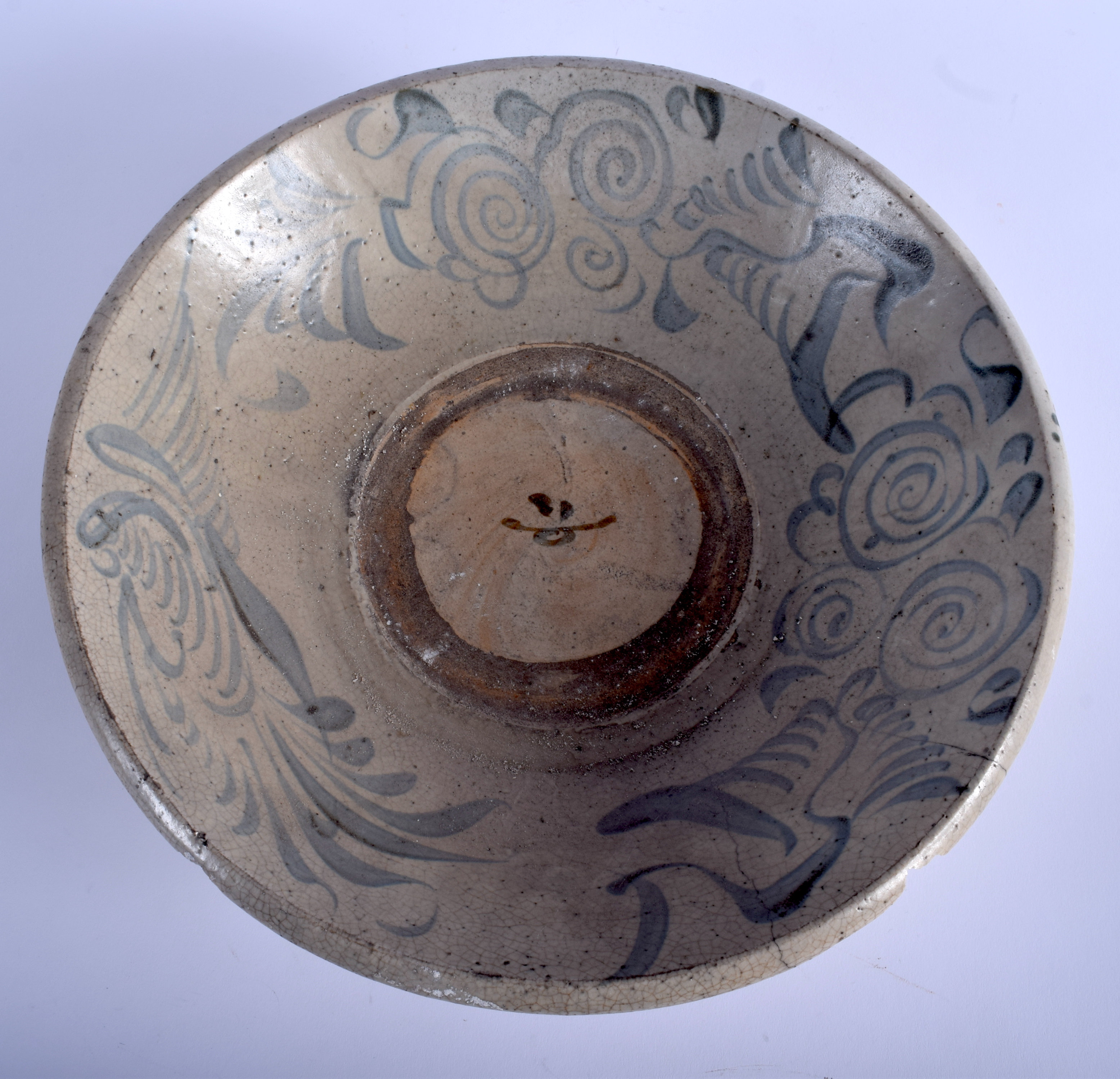 AN 18TH CENTURY CHINESE VIETNAMESE BLUE AND WHITE STONEWARE BOWL painted with swirling motifs. 32