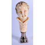 A 19TH CENTURY FRENCH NAPOLEON II L'AIGLON BONE DESK SEAL. 6.5 cm high.