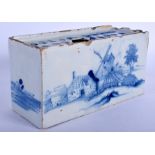 AN 18TH CENTURY EUROPEAN BLUE AND WHITE DELFT FAIENCE GLAZED FLOWER BRICK painted with landscapes.