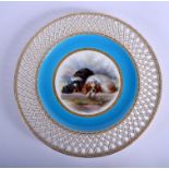 Late 19th c. Minton fine plate painted with black and white spaniels under a turquoise and pierced