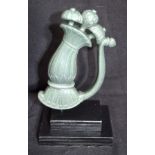 An Indian Jade dagger handle mounted on plinth. 15cm