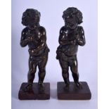 A PAIR OF 19TH CENTURY FRENCH BRONZE FIGURE OF STANDING PUTTI one upon a later base. Bronze 18 cm h