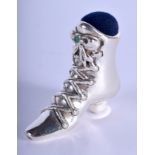 A SILVER BOOT PIN CUSHION. 4 cm x 3 cm.