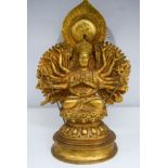 A bronze multi armed Buddha 28cm