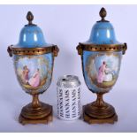 A PAIR OF 19TH CENTURY FRENCH SEVRES PORCELAIN VASES AND COVERS painted with figures and jewelled w