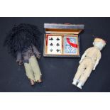 Two voodoo type plastic dolls and leather topped playing card box