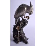 A 19TH CENTURY JAPANESE MEIJI PERIOD SILVERED OKIMONO OF A BIRD modelled upon an alloy base. 22 cm