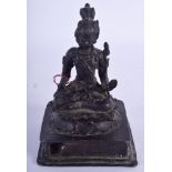 AN EARLY MIDDLE EASTERN BRONZE FIGURE OF A BUDDHISTIC DEITY modelled upon a square plinth. 14 cm x