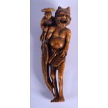 A LARGE 19TH CENTURY JAPANESE MEIJI PERIOD STAINED IVORY NETSUKE modelled as oni with a farmer upon