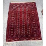 A Red ground Oriental rug. 176cm x 122cm