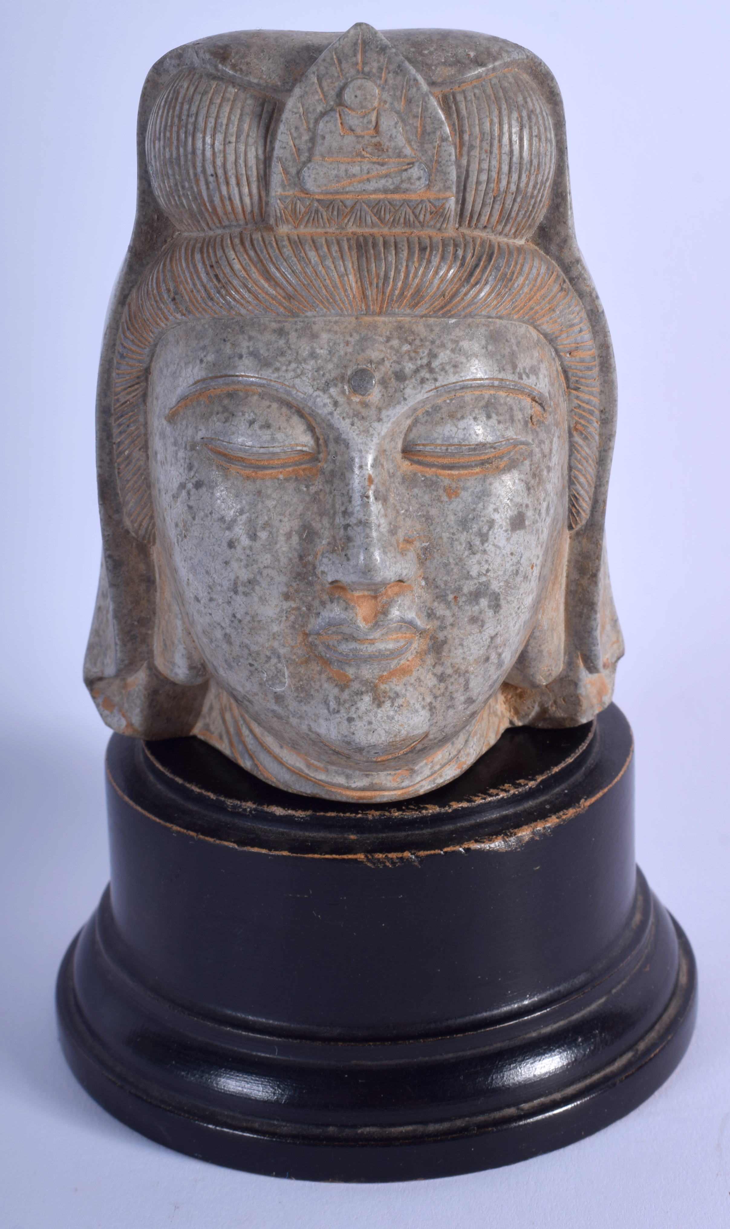 AN EARLY 20TH CENTURY CHINESE CARVED STONE HEAD OF A BUDDHISTIC DEITY Late Qing/Republic. Stone 11