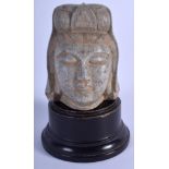 AN EARLY 20TH CENTURY CHINESE CARVED STONE HEAD OF A BUDDHISTIC DEITY Late Qing/Republic. Stone 11