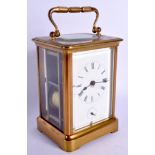 AN ANTIQUE FRENCH BRASS CARRIAGE CLOCK. 15 cm high inc handle.