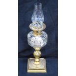 A Victorian Oil Lamp on a brass column 54cm