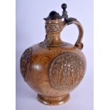 A FINE ANTIQUE GERMAN BELLARMINE MERKELBACH GRENZHAUSEN BELLARMINE JUG with pewter mounts. 27 cm hi