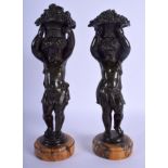 A PAIR OF 19TH CENTURY FRENCH BRONZE FIGURES OF STANDING PUTTI modelled holding aloft baskets. 28 c