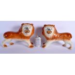 A LARGE PAIR OF ANTIQUE CONTINENTAL POTTERY LIONS modelled roaming. 28 cm x 26 cm.