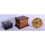 A RUSSIAN PAINTED LACQUER BOX together with a cigarette box & an ormolu roundel. (3)