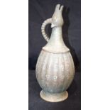 An Islamic silver and lead water jug. 33cm tall