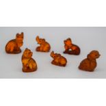 Six tiny carved amber elephants 3 cm