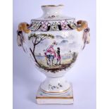 AN 18TH CENTURY FRENCH FAIENCE POTTERY URN painted with figures and landscapes. 20 cm high.