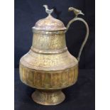 An Islamic bronze, silver and lead water jug. 28cm tall