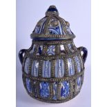 A MIDDLE EASTERN FAIENCE JAR AND COVER with white metal overlay. 26 cm x 16 cm.