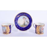 TWO 19TH CENTURY FRENCH SEVRES PORCELAIN CUPS together with a similar saucer. (3)