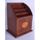 AN EDWARDIAN MAHOGANY LETTER RACK inset with a satinwood star. 21 cm x 12 cm.