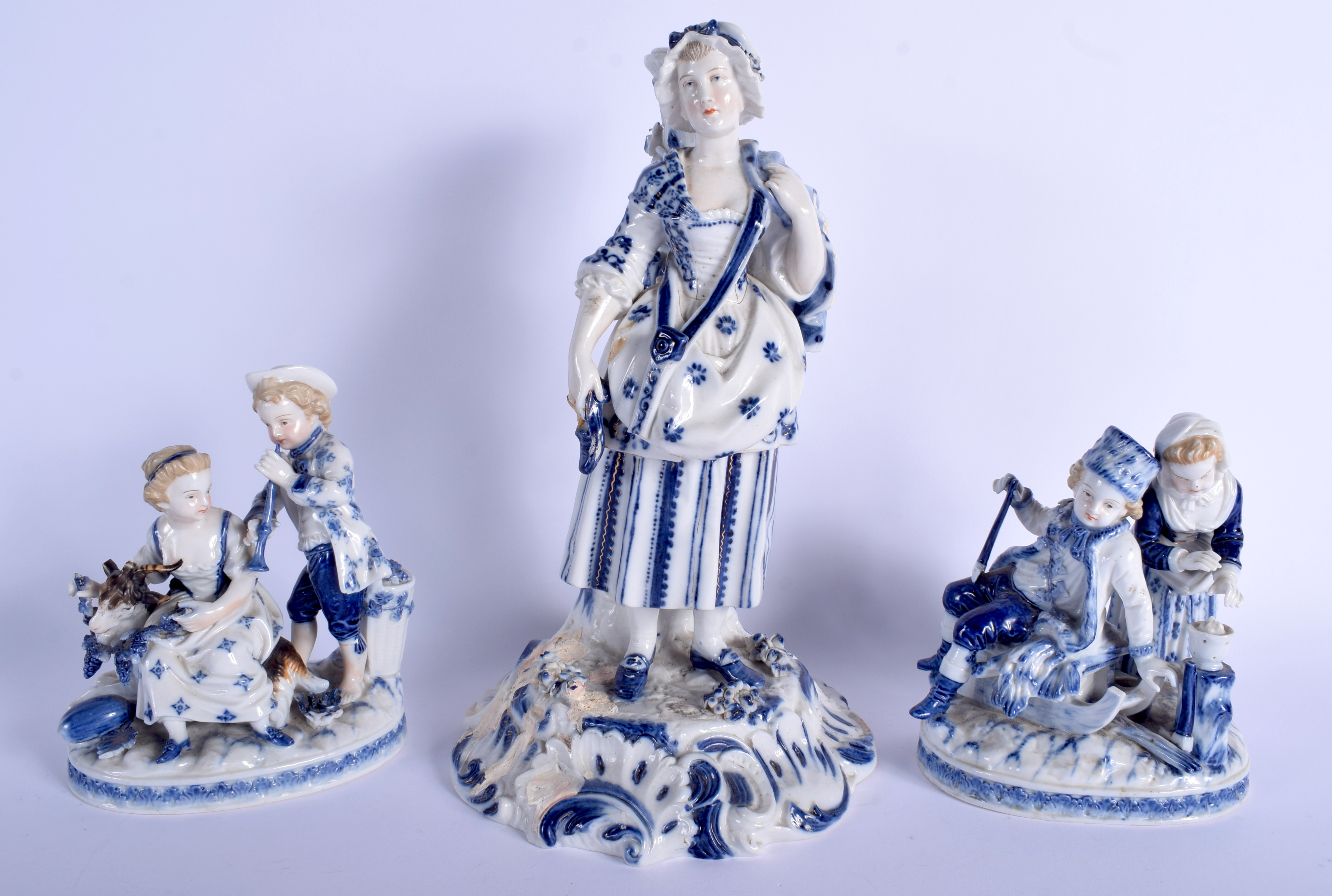 A PAIR OF 19TH CENTURY GERMAN AUGUSTUS REX PORCELAIN FIGURES together with a large matching figure.