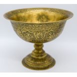 A brass heavily engraved Persian bowl 12cm