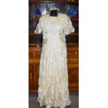 A vintage hand made silk wedding dress with waist jacket and hair garland